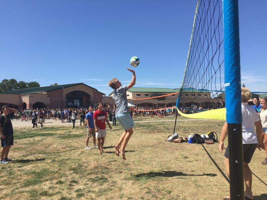 A volleyball game in progress in the quad.