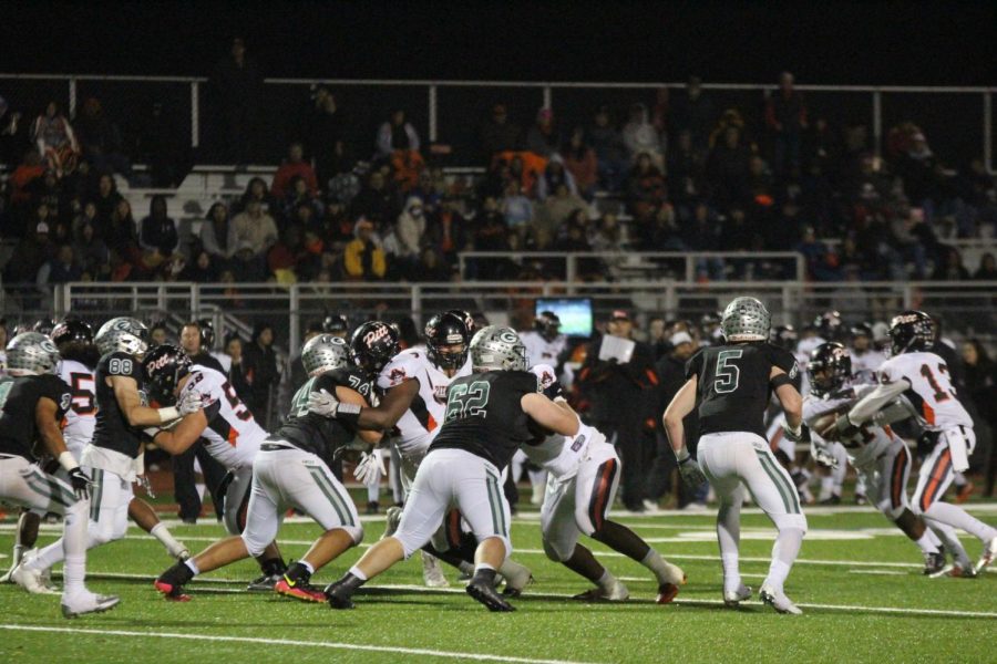 Jack Powers, 5, and the Grizzly defense hold tight in the first quarter. 