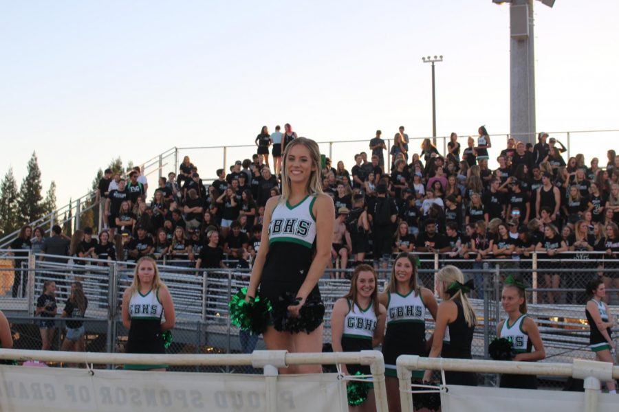 Senior+Faye+Miller+cheering+on+the+sideline+of+a+GBHS+varsity+football+game