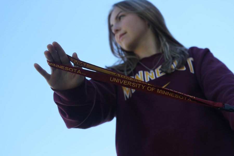 Proudly showing off her key chain, sophomore Aynsley Conner supports the University of Minnesota after being offered a scholarship.