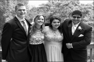 GBHS student Daniel Patterson and alumni Olivia Caserta, Laynee Daniels and Angikaar Chana (left to right) take photos before Senior Ball