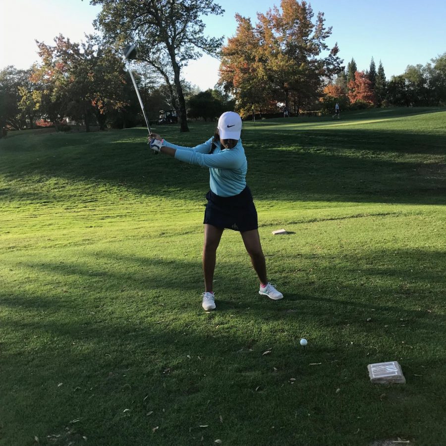 Dedicated player Anika Varma swings back on the golf course.