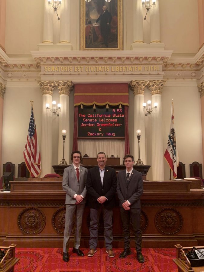 Seniors Jordan Greenfelder, left, and Zack Haug pose with Sen. Brian Dahle to whom they proposed the idea to allow 17-year-olds to be able to vote in the California primary election if they would be 18 by the time of the general election in November.