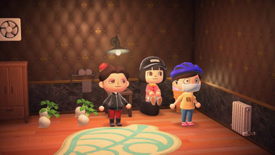 Three real-life players congregate in a house in Animal Crossing: New Horizons.