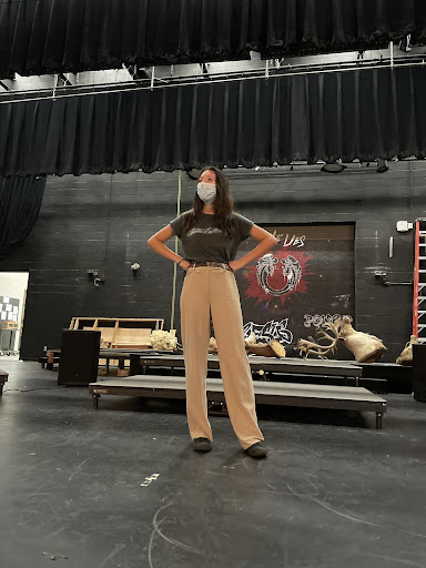 Serene Cheng stands up on the theater stage.