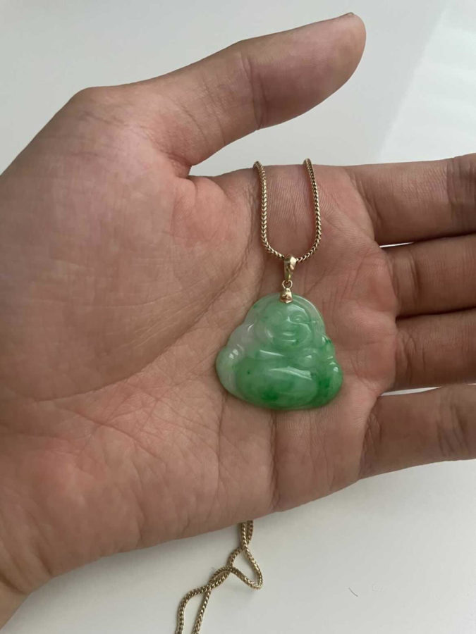 Khoa Nguyens beautiful jade laughing Buddha necklace.