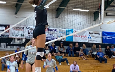 Abigayle Gotwals jumps to block a swing from the Rocklin High School Varsity Volleyball team on Sep. 19, 2022. 
