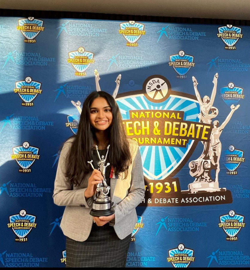 Senior and Speech and Debate co-captain Salini Pillai poses with her trophy after winning 14th place in Speaker in LD. 