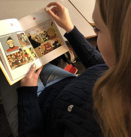 Students sit down to read American Born Chinese, which has content and a style of literature that has raised concerns through parents and the students themselves. 