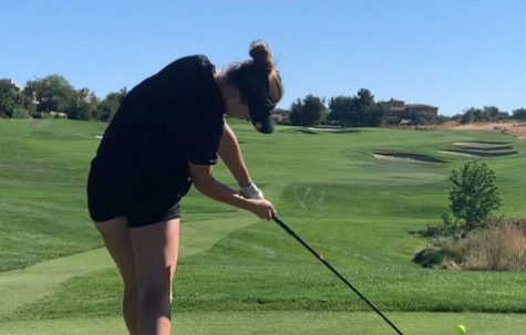 Senior Ellie Bushnell tees off, helping the Grizzlies secure another season match win against Oak Ridge High School at Serrano Country Club.