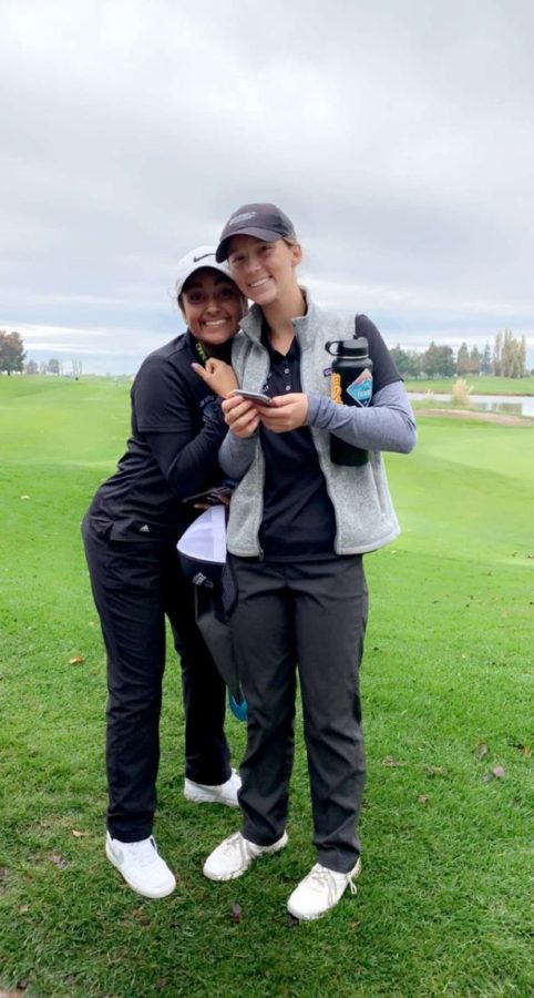 Anika Varma, the 2021 co-captain of the Granite Bay High School varsity girls golf team, hugs her teammate Ellie Bushnell.  