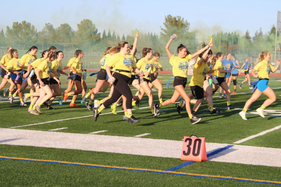 The excitement in the air was unmatched as the senior class rushed onto the field, armed with plenty of spirit for the 2023 Powderpuff game.
“I felt energized and empowered. It was so fun with all the yellow smoke around us, I felt like all of us girls were just one close team,” senior Isabella Montez said. 