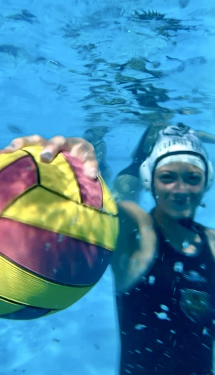 Georgia Watson, a freshman on the team, poses for an underwater headshot before her last game of the season against El Camino.
“Can you get one of me underwater?” asks Watson.