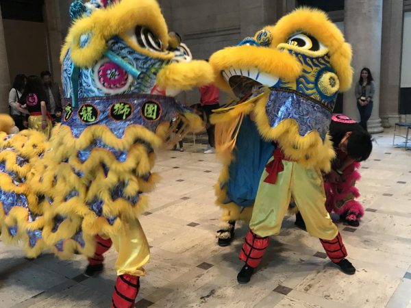  At the Creative Space Lunar New Year celebration in Old Town Elk Grove, vibrant yellow and blue lions take part in a Lion Dance (Teng Fei Lion Dance Performing Arts Group). 