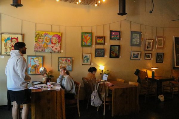 Fig Trees interior is filled with local artists work and lamp light.