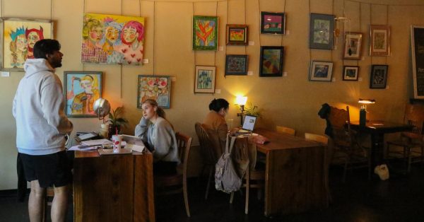 Fig Trees interior is filled with local artists work and lamp light.