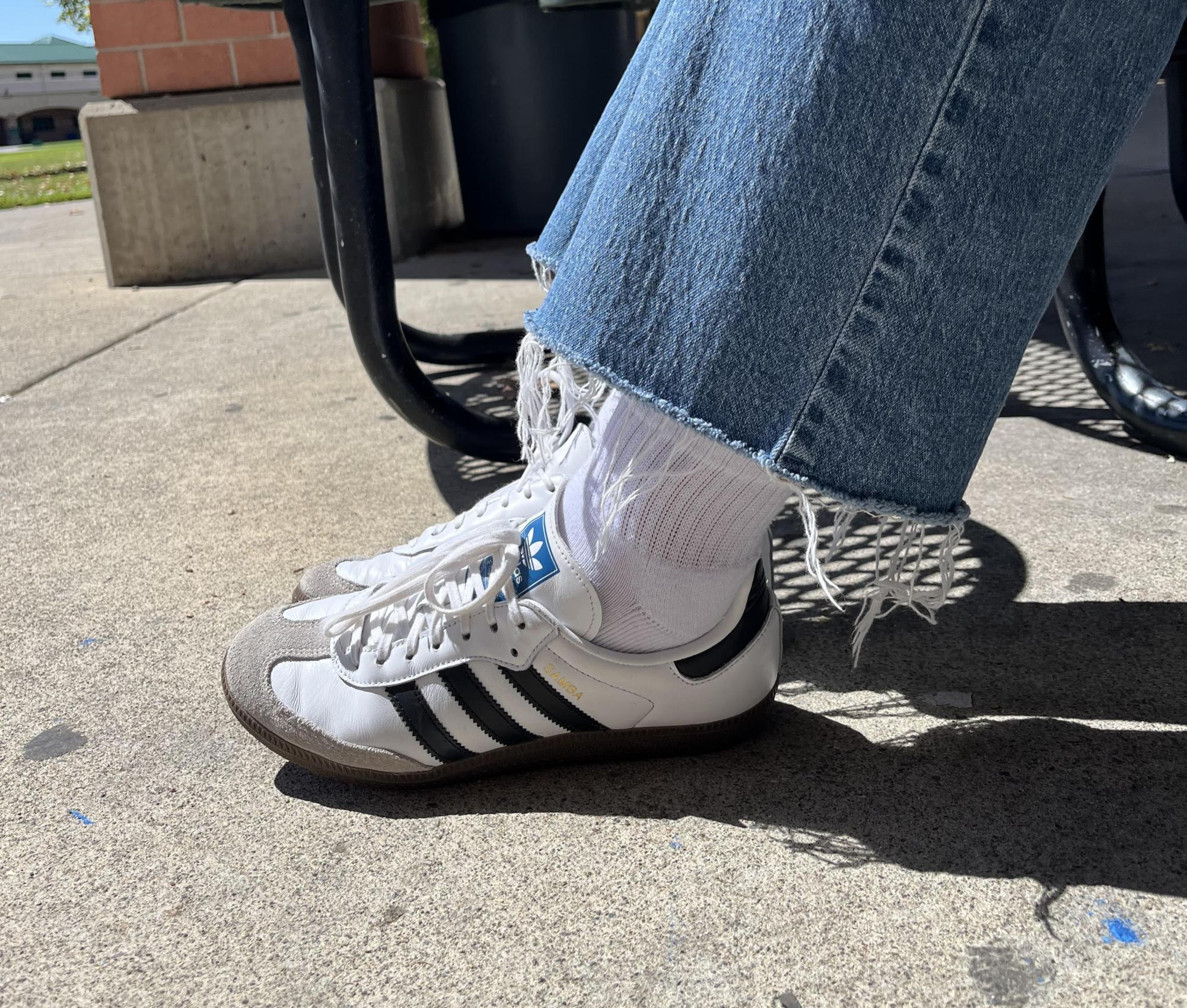 Junior Bridget Chandler and her classic white Sambas  “I saw them a lot on everyone I know, and I thought they looked really cute and just a basic choice.”