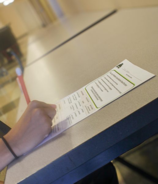 In this photo illustration, the student fills out a freshman course selection form. 