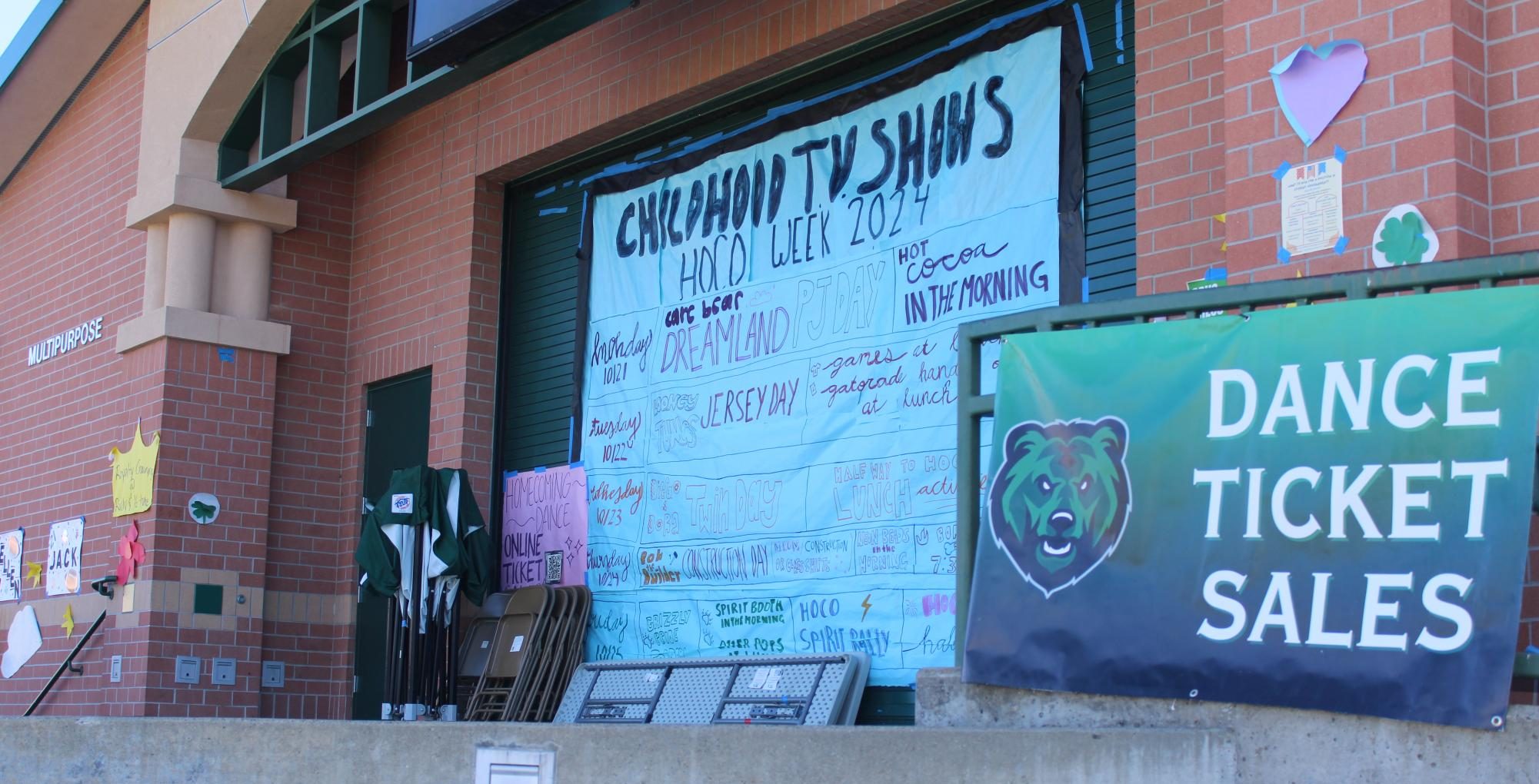 Posters promoting Homecoming events hang on the stage in the quad.