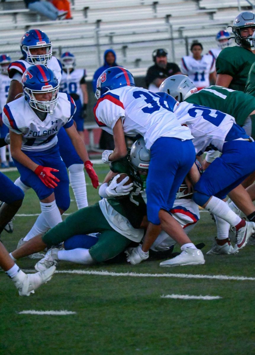 Charley Stathem (#2) getting tackled at the 43 yard line.