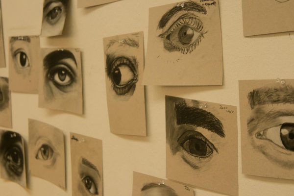 The walls of the classroom are covered in art exercises from all kinds of students. These eyes were drawn by the Art 2 students.