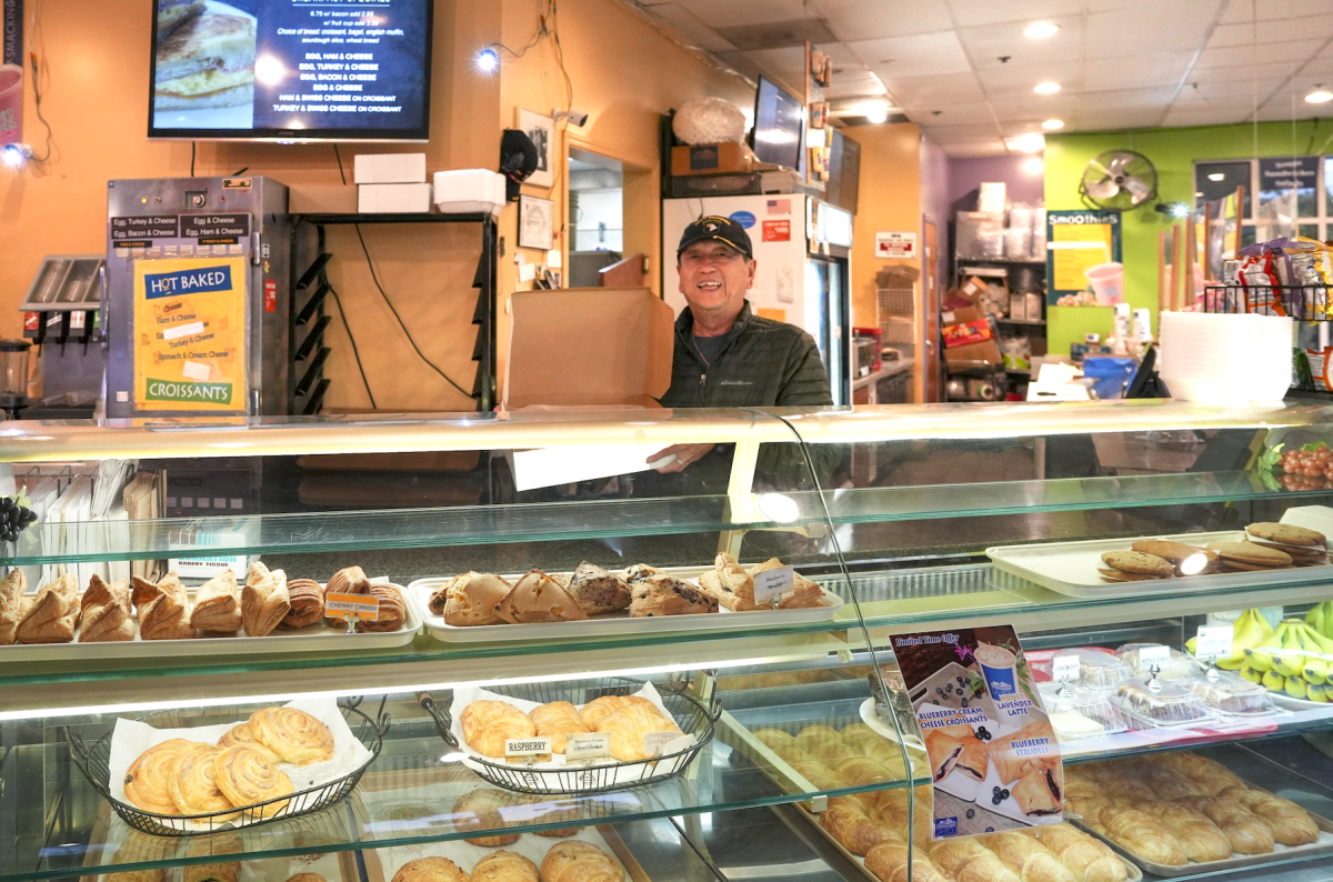 Quang Tran, owner of La Bou, displays  pastries and croissants. 