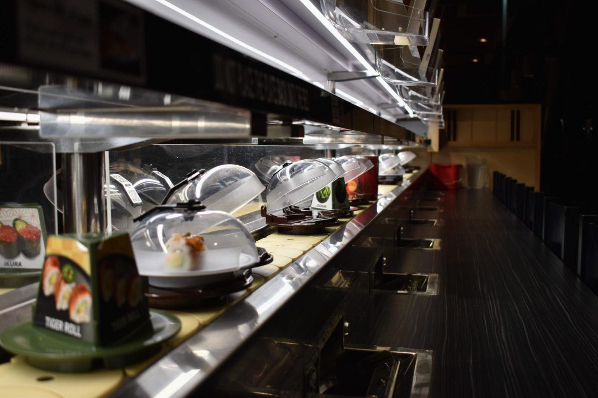 The sushi is served through a revolving sushi bar, allowing customers to independently serve themselves.