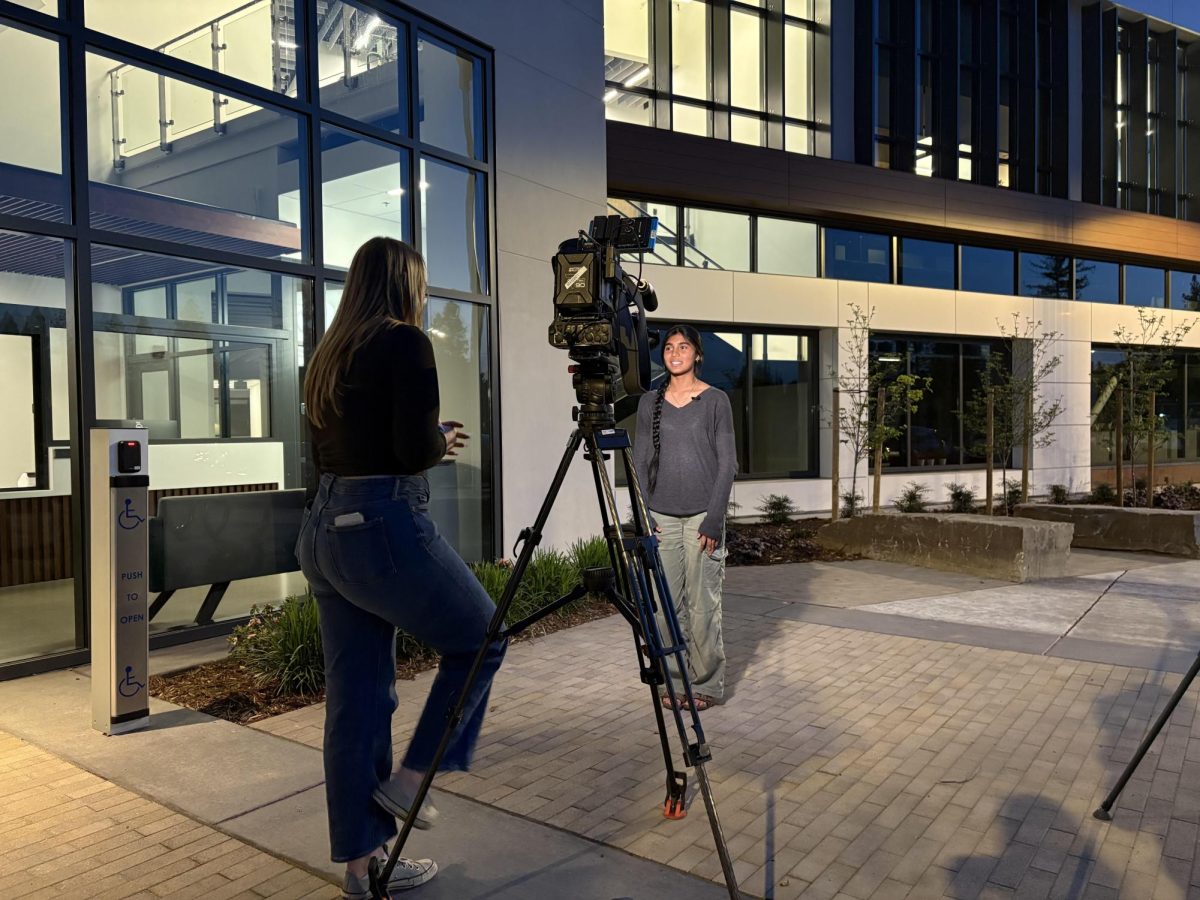 Student being interviewed by media outside of the district board meeting. 