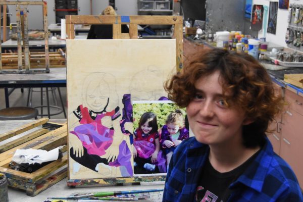 Fynn Gaillard prepares his art for the art show. 