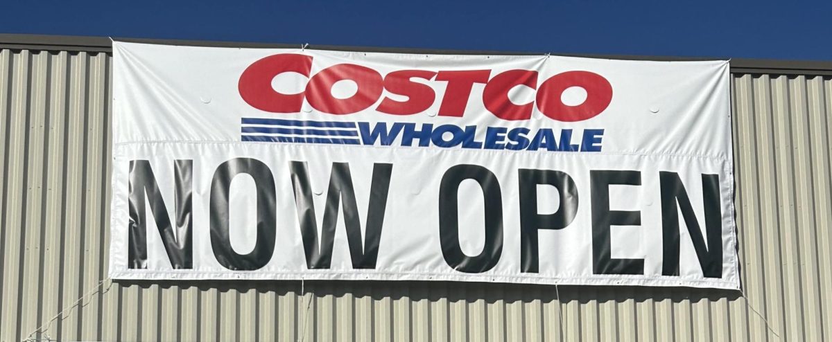 Costco grand opening banner hangs above the store. 