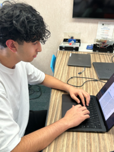 Pranil Raichura, a Junior at GBHS works on refining his research photo.