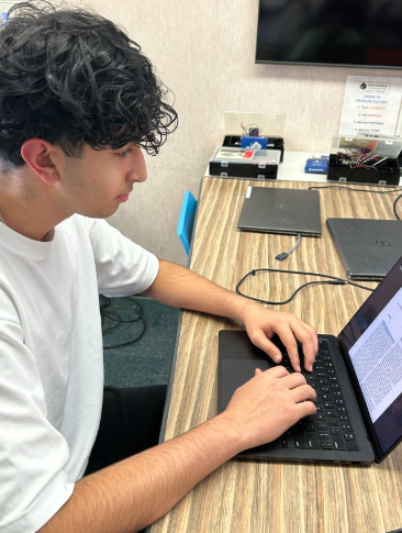 Pranil Raichura, a Junior at GBHS works on refining his research photo.