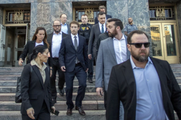 Meta CEO Mark Zuckerberg (center) leaves the courthouse after testifying on Feb 18, 2026. 
Courtesy of Apu Gomes/AFP via Getty Images